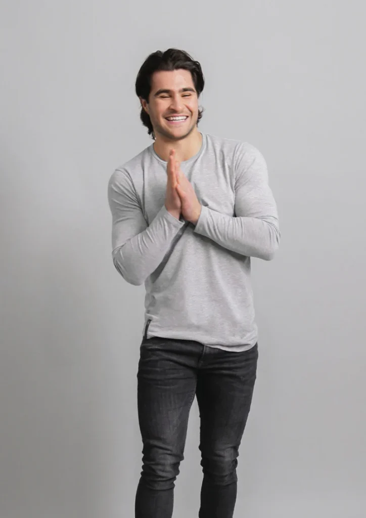 long sleeve curved hem granite ten10 apparel shirt with male model in the shirt smiling due to premium shirt quality