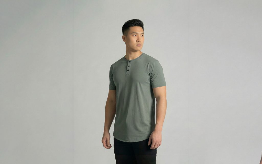 best men's shirt for warm weather. Man in a sage short sleeve henley from ten10 apparel