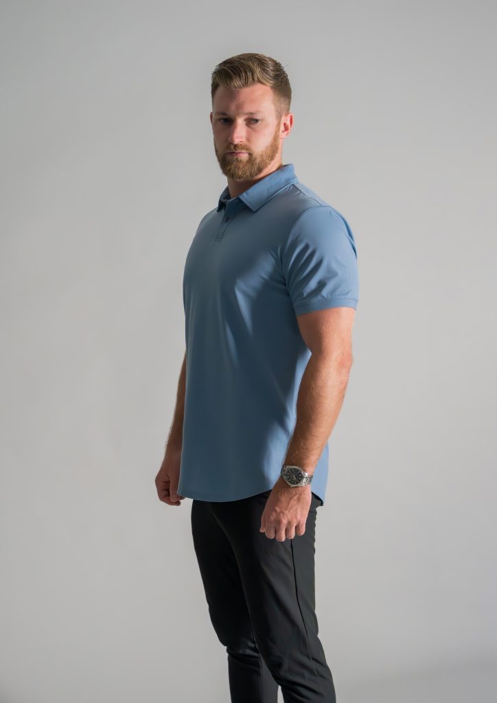 Male model in Oasis Stratus Polo from Ten Ten apparel looking down view