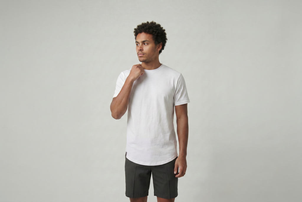 Man holding neck line of a heritage curved hem luxury tee from ten 10 apparel