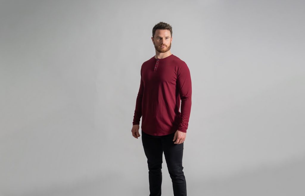 Man in a long sleeve red henley from ten10 apparel