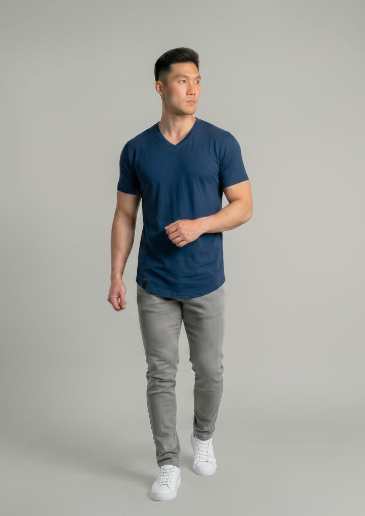 man walking in an Oxford blue vneck from ten10 apparel