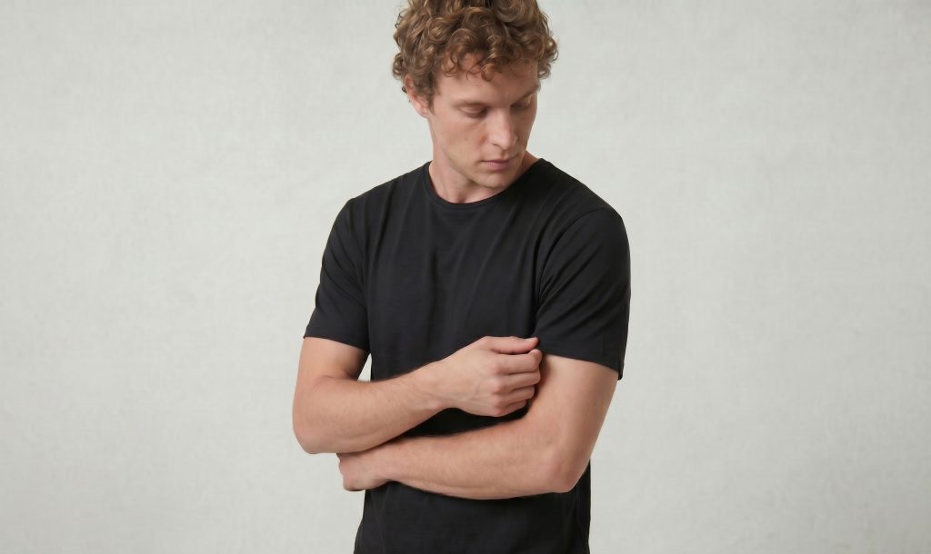 black heritage tee holding shirt
