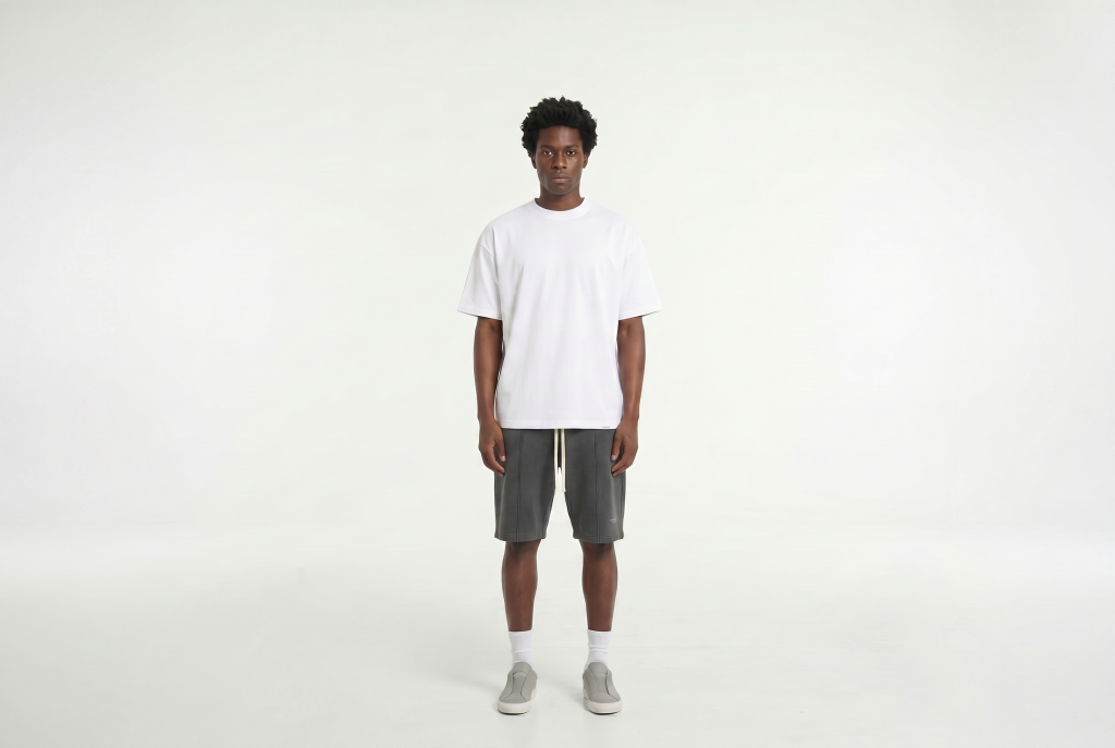 Man in a short sleeve alto relaxed tee standing in white background