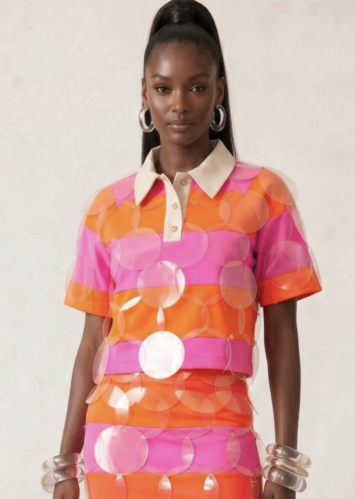 black lady in a designer citrus punch striped bubbles polo dress from bruceglen