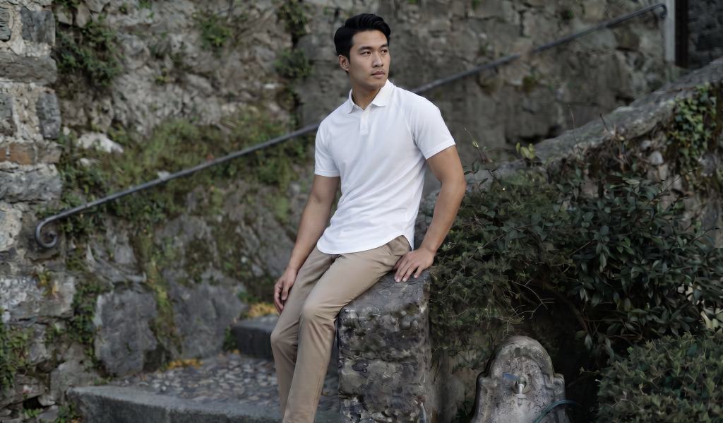 Asian man in white polo and khaki pants