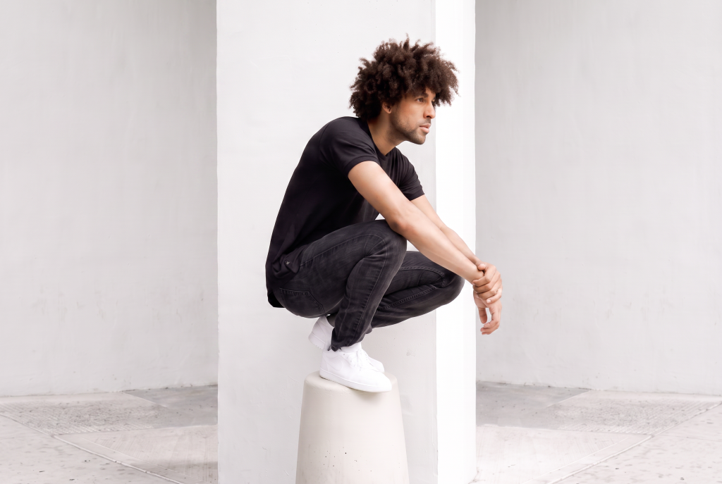 man in black curved hem tee similar to 021 originals