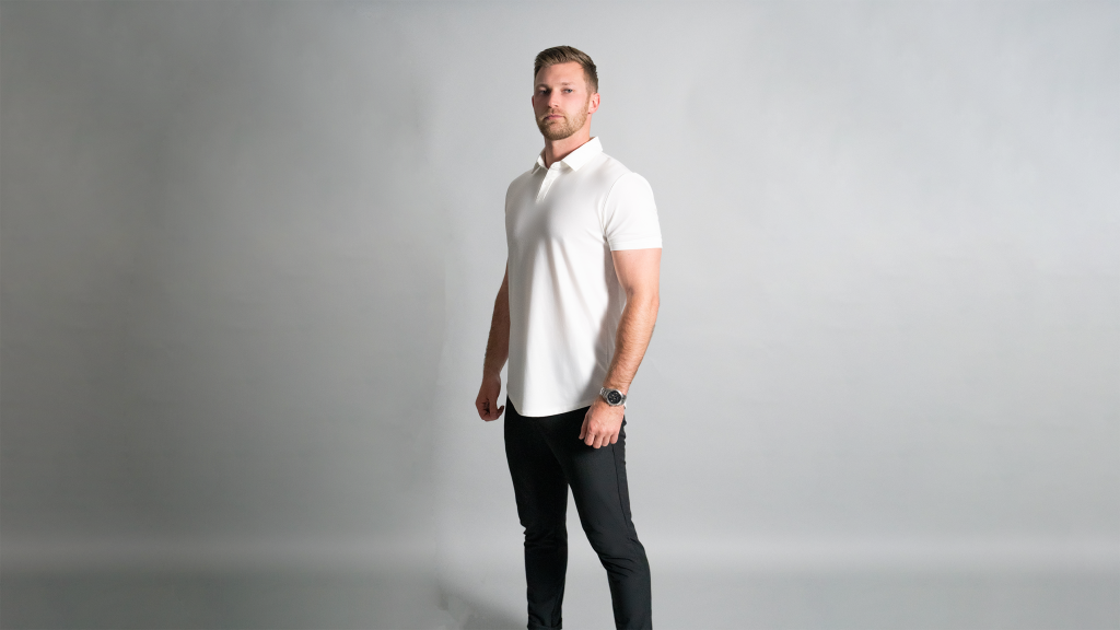 man in a mens Muscle fit white polo