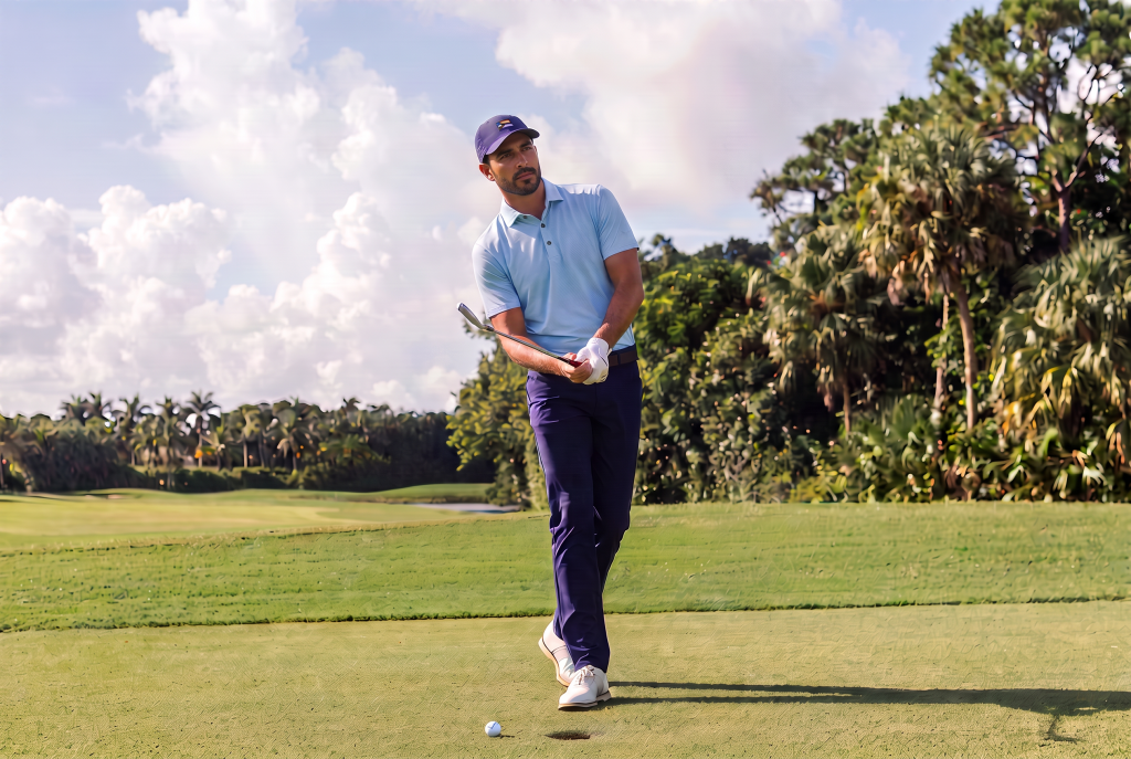 man in light blue golf polo