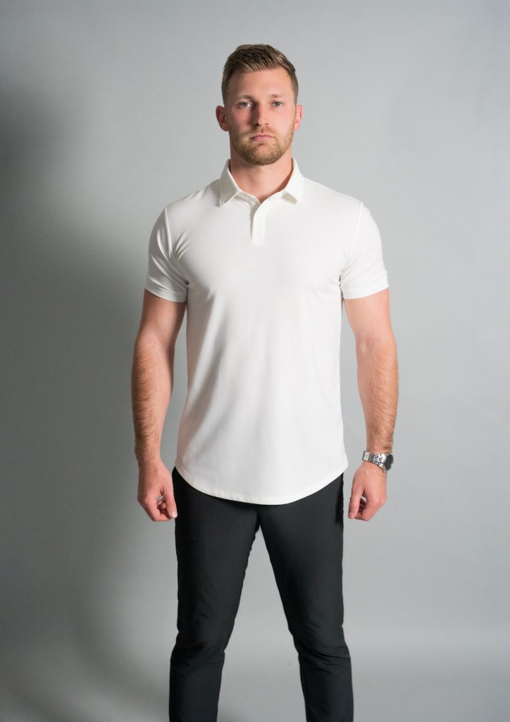 Man in athletic fit white polo